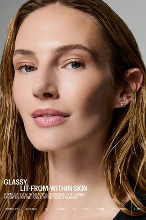 Model with glowing skin, Allies of Skin Founder's Essence 56 Ellagic & P.A.D. Light Reflecting Fluid, glassy lit-from-within skin